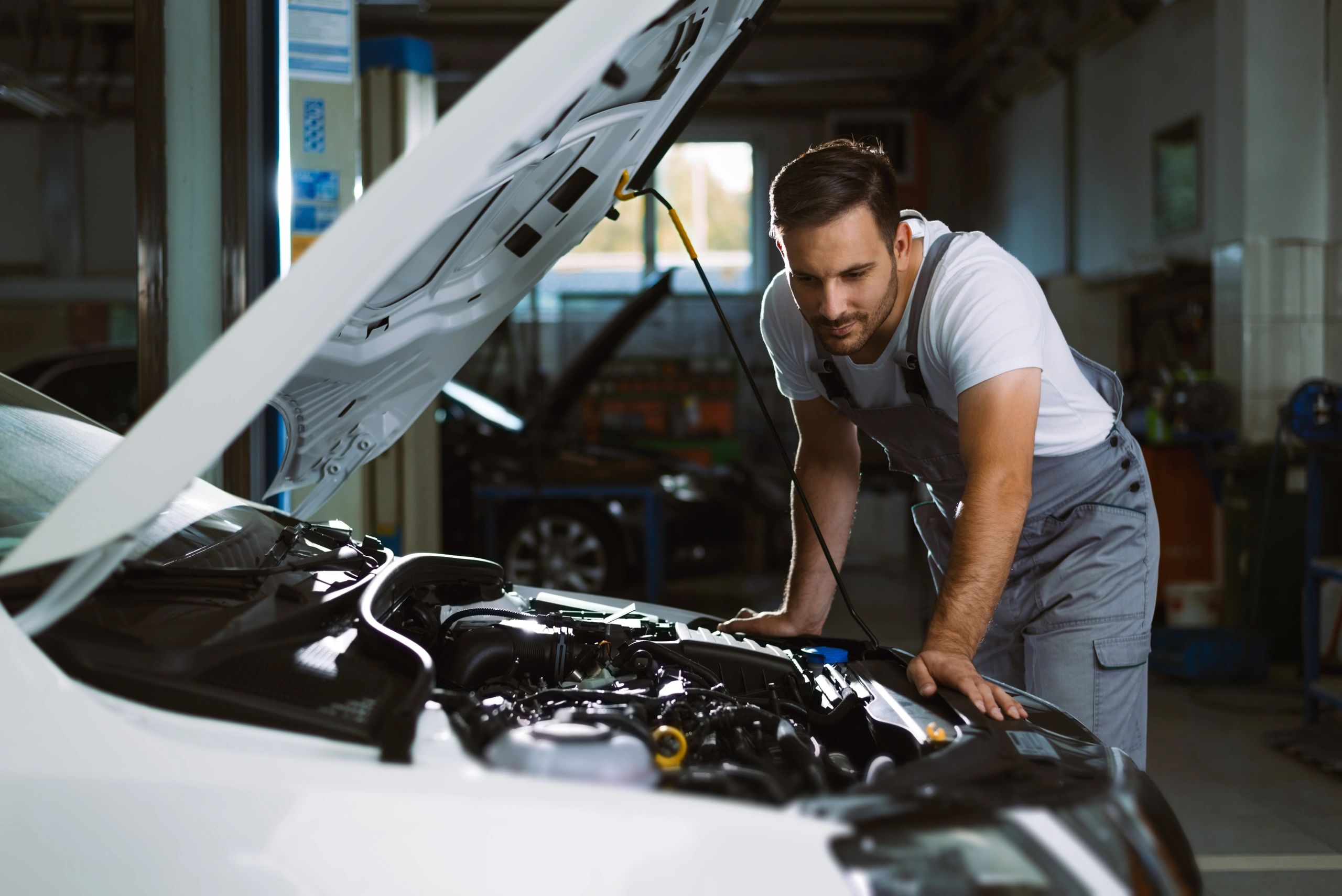Mechanic analyzing engine problems
