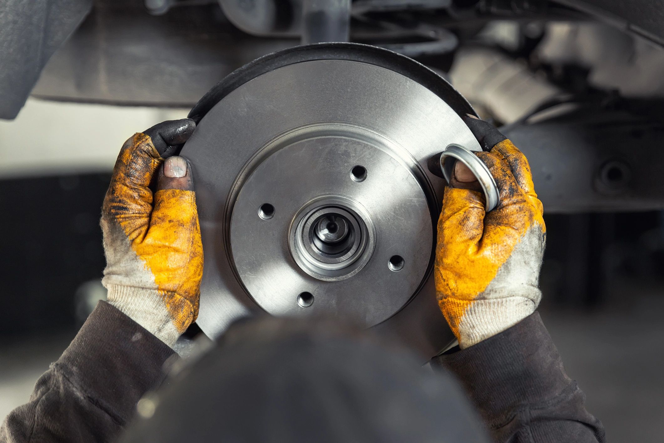 Technician installing a brake rotor during service
