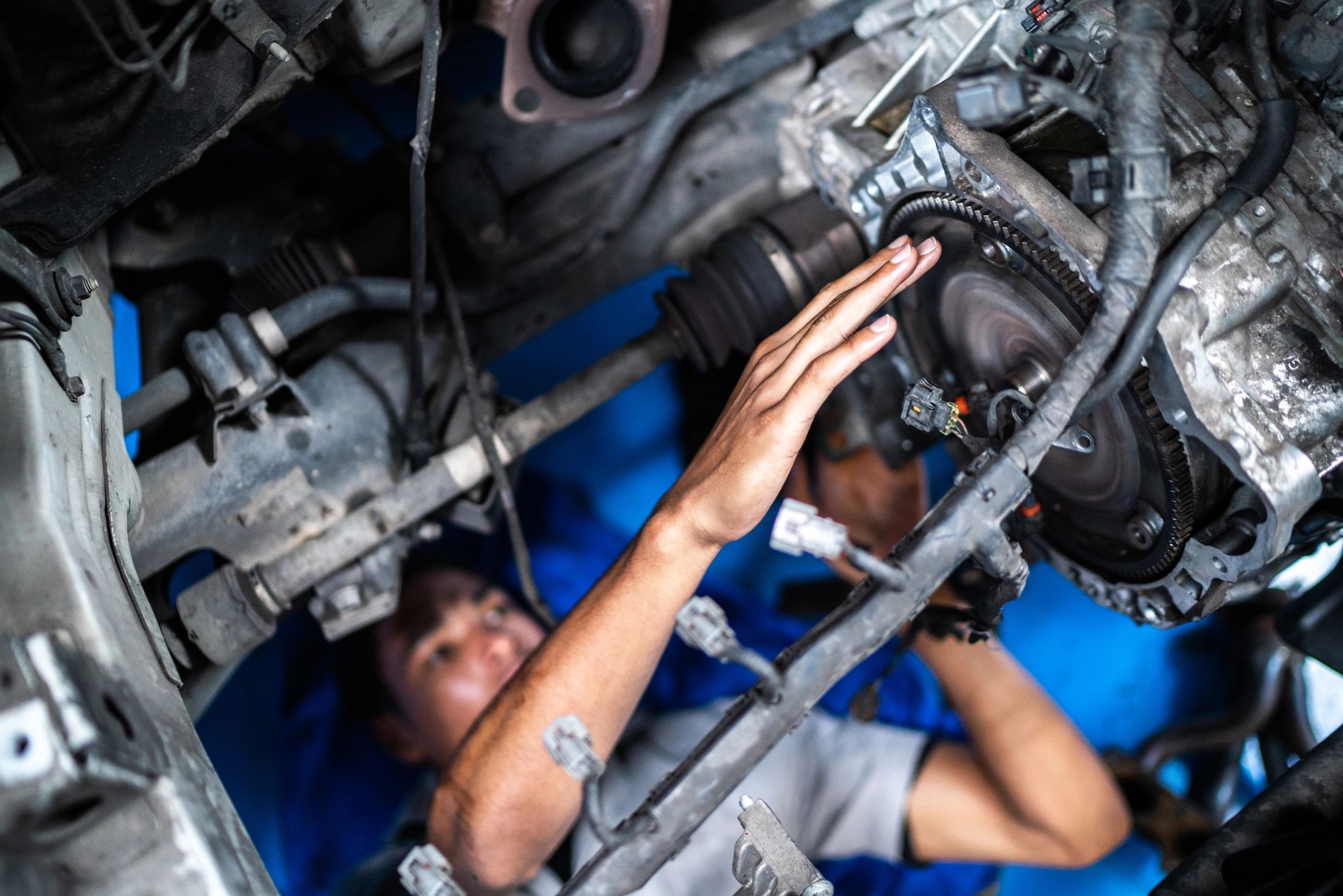 Mechanic repairing a vehicle in a shop