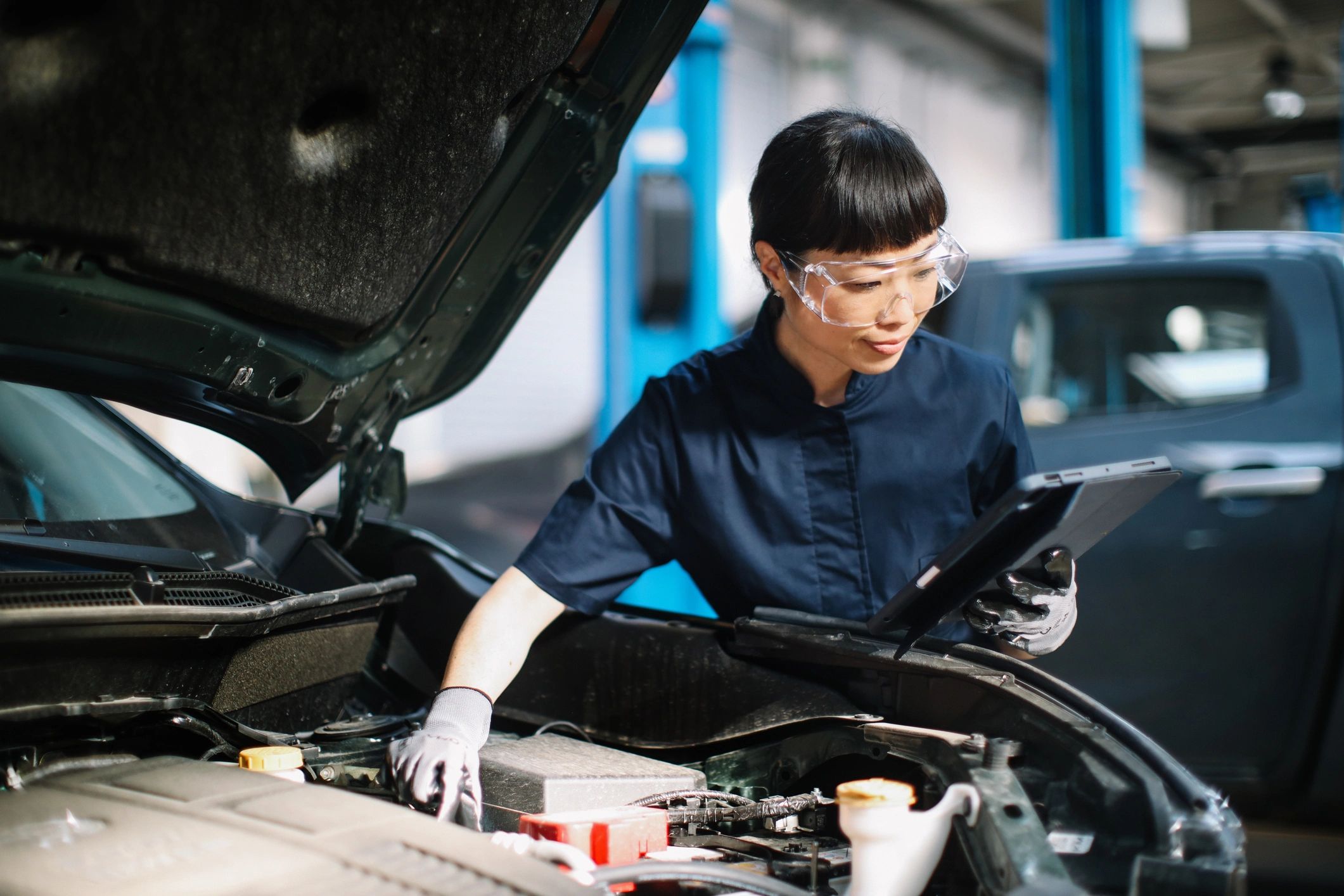 Technician performing an oil change inspection